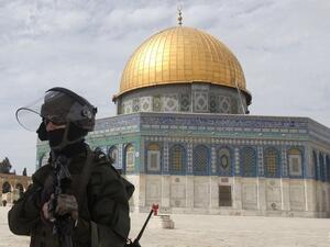 An Israeli security officer stands infront of Al Haram Al Sharif in Jerusalem, the third holiest site in Islam. Israelis frequently prevent Muslims from praying and launch attacks against non-Jewish worshippers. AFP Photo