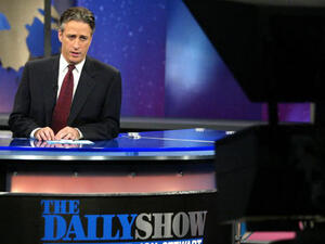 Jon Stewart sitting in his "Daily Show" chair (Photo by Peter Kramer/Getty Images)