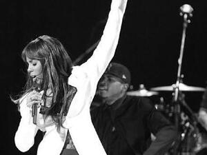 Kelly Rowland raising her left hand that now sports some serious bling! (Image: Facebook)