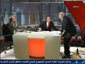A still of the Al-Jazeera video that involves the altercation Lebanese pro-regime analyst Joseph Abu Fadel and Syrian opposition activist Muhieddine Ladkani on live television. A still of the Al-Jazeera video that involves the altercation Lebanese pro-regime analyst Joseph Abu Fadel and Syrian opposition activist Muhieddine Ladkani on live television.