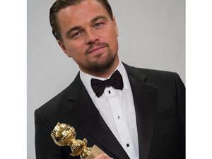 Leonardo DiCaprio with his award for "The Wolf of Wall Street" (Image: Facebook)