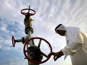 A man inspects a natural gas pipe in Bahrain