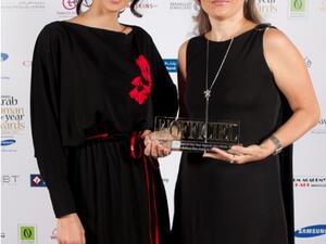Larissa Kuzmina, Marketing Manager of Mauzan, receiving L’Officiel Middle East Arab Woman of the Year Award 2011