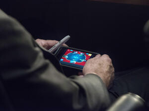 Papped! John McCain plays poker on his smartphone during a crucial Syria hearing (Photo courtesy: The Washington Post)