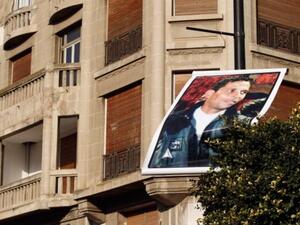 A photo of Mohamed Bouazizi floats about Avenue Bourghiba in Tunisia's capital.