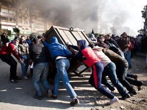 The court found the defendants guilty of organizing street protests and provoking violence. Here, Brotherhood supporters are seen in Cairo in August 2013. (AFP/File)