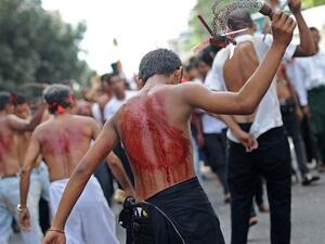 A Shia boy flogs himself during the Ashura celebrations in Myanmar.