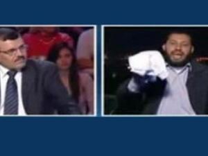 Nasr al-Din al-Alawi, a Salafi cleric and imam, was shown in a TV interview brandishing a white cloth, used for a coffin, as a sign that he is willing to sacrifice his life. 