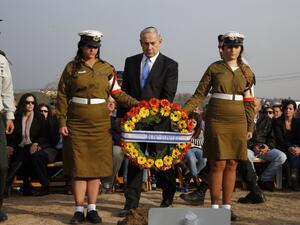 Israel's Prime Minister Benjamin Netanyahu arrives to lay a wreath during the funeral of former Israeli Prime Minister Ariel Sharon on January 13, 2014 at the family ranch Havat Shikmin, near the Israeli city of Sderot in the southern Negev desert. (AFP)