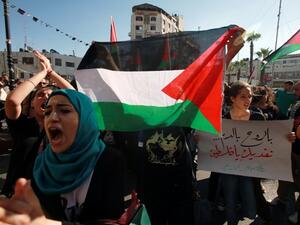  Protesters shout slogans during a demonstration against the Israeli government on July 15, 2013 near the West Bank town of Ramallah. (AFP)