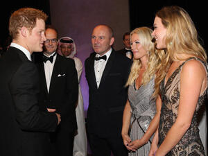 Prince Harry at the 'Forget Me Not' reception with Joss Stone and presenter Denise Van Outen in Dubai yesterday. Meeting lovely ladies isn't distracting the Prince from his royal romance. (Photo by Chris Jackson/Getty Images)