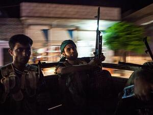 Syrian rebels head to the town of Bsankol in the northwestern province of Idlib to join comrades fighting regime forces for the control of the highway that connects Idlib with Latakia on 11 July 2013. (AFP/File) Syrian rebels head to the town of Bsankol in the northwestern province of Idlib to join comrades fighting regime forces for the control of the highway that connects Idlib with Latakia on 11 July 2013. (AFP/File)