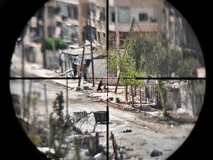 Syrian snipers, when bored, shoot at pregnant women and civilians as a game, a UK doctor said (AFP/File)