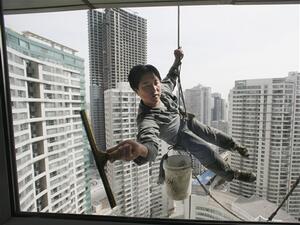 Did a Bangladeshi man watch a woman cleaning herself as he cleaned her windows?