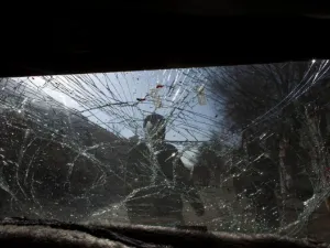 Glass is smashed on a car as Afghan soldiers block the scene after a suicide bomber&amp;#039;s attack on January 12, 2011 in Kabul.