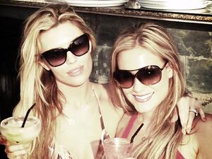 Abbey Crouch poses with a pal in the sunshine (Photo: Twitter / Abbey Crouch)