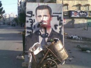 صورة مشوهة للرئيس السوري بشار الاسد في حلب 