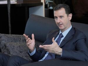 SYRIA, DAMASCUS : A handout picture released by the Syrian Arab News Agency (SANA) on August 26, 2013 shows Syrian President Bashar al-Assad giving an interview with Russian newspaper Izvestia in Damascus, during which he warned the United States of "failure" if it attacks Syria. AFP PHOTO / HO / SANA