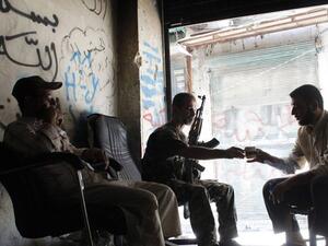 مقاتلون من الجيش الحر في حي باب التصر في حلب