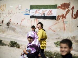 Children walk home from an improvised school in Azaz (AFP) Children walk home from an improvised school in Azaz (AFP)