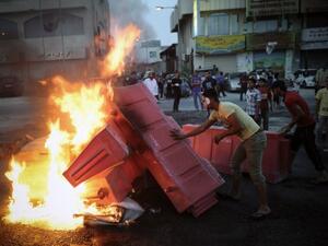 Bahraini protesters put fire on barricades during clashes with riot police following a protest against the Formula One Grand Prix on Friday in the village of Sanabis, west of Manama. (Photo: AFP PHOTO/MOHAMMED AL-SHAIKH)