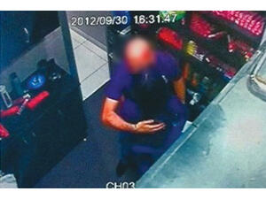 The defendants, though, told the court the kiss - captured on CCTV (pictured) - was just a birthday peck on the check.