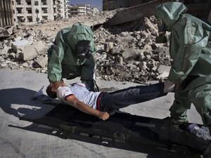 The UN chemical weapons team are expected to arrive in Damascus in Wednesday. Here, residents in Aleppo stage a drill for a potential weapons attack. (AFP/File)