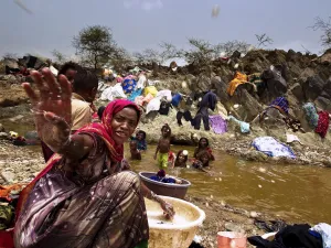 During intense water shortages, small amounts of water must be carried long distances to be used.