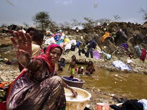 During intense water shortages, small amounts of water must be carried long distances to be used.
