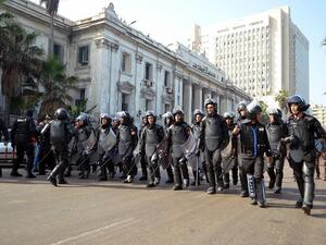 Egypt riot police officials approach protestors outside of a court in Alexandria. The new military trial article that allows civilians to be tried in front of a military court has elicited criticism and protest from many Egyptians as well as regional and international human rights groups (AFP) Egypt riot police officials approach protestors outside of a court in Alexandria. The new military trial article that allows civilians to be tried in front of a military court has elicited criticism and protest from many Egyptians as well as regional and international human rights groups (AFP)