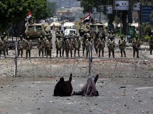 Egyptian women face off with police on July 8, 2013. (source: AFP / MAHMUD HAMS) Egyptian women face off with police on July 8, 2013. (source: AFP / MAHMUD HAMS)