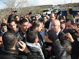 An angry Hamdallah got out of his car and hurled accusations at the army for unjustly pulling over his convoy. [Farah Studio]
