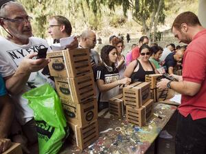ISRAEL, Haifa : Israelis queue to collect gas mask kits at a distribution center in the Mediterranean coastal city of Haifa, north of Israel, on August 29, 2013. AFP PHOTO / JACK GUEZ