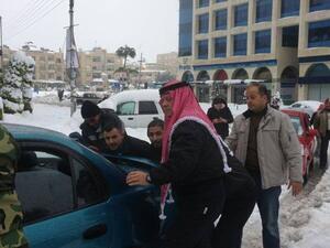 Jordan's King Abdullah went to the streets Saturday to help residents dig their cars out from layers of snow that has trapped many people throughout the Kingdom (Courtesy of Jordan Times)