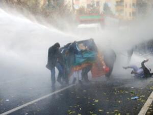 Turkish police used water cannons and tear gas to break up a Kurdish protest in Yuksekova, leaving two people dead. (Mehmet Engin/AFP)