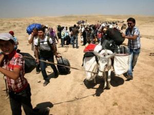 الاف الاكراد الجائعين والخائفين يتدفقون الى العراق من سوريا
