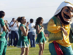 The American-Arab Anti-Discrimination Committee (ADC) called on the school earlier this year to change its mascot, citing its large nose, heavy beard, and kaffiyeh garments as perpetuating stereotypes of Arabs and Arab Americans (Marilyn Chung/AP)