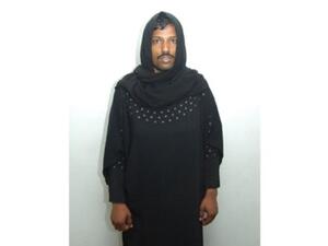 A man donned an abaya for UAE Ladies Day but the moustache gave him away