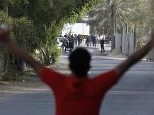 ارشيف/ متظاهر يواجه قوا ت الامن في احد الاحياء قرب المنامة