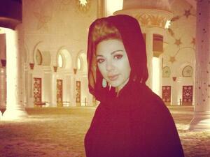 Myriam covered up for a visit to Abu Dhabi's Sheikh Zayed Mosque (Photo: Facebook)