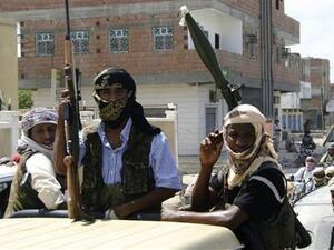 مسلحون ينتمون لجماعة انصار الشريعة المرتبطة بتنظيم القاعدة على متن شاحنة صغيرة في بلدة جعار باليمن، 
 مسلحون ينتمون لجماعة انصار الشريعة المرتبطة بتنظيم القاعدة على متن شاحنة صغيرة في بلدة جعار باليمن،