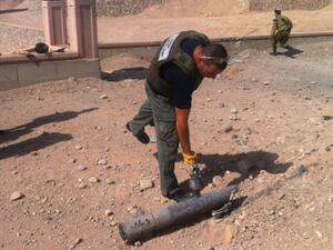 Man inspects a rocket that landed in Israel (used for illustrative purposes)