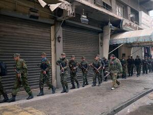 Syrian government forces deploy themselves in the streets of Syria's second city Aleppo. (AFP PHOTO / STR)