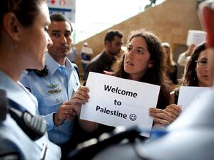 Left wing Israeli activists are arrested by Israeli police as they demonstrate in favor of the 'Welcome to Palestine' fly-in protest. Left wing Israeli activists are arrested by Israeli police as they demonstrate in favor of the 'Welcome to Palestine' fly-in protest.