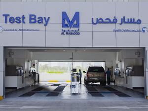 The operation is a joint servicing agreement with ADNOC Distribution & Abu Dhabi Police and offers vehicle inspection services.
