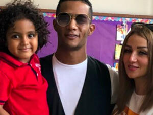 Ramadan posted a picture to his Instagram account in which he is carrying his son Ali and his wife stands next to him (Source: mohamedramadanws - Instagram)