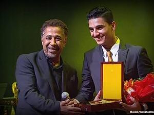 Assaf receives an award from Cheb Khaled in Algeria. (Facebook)