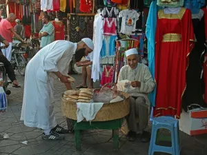 A man selling bread in front of a shop in Marrakesh. (Pixabay)