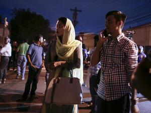 Community members pray outside the Al-Furqan Jame Mosque in Queens, NY. (AFP/Kena Betancur)
