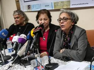 Seif el-Dawla , Suzan Fayyad, center, and Magda Adly, right, co-founder of El Nadeem Center for Rehabilitation of Victims of Violence, hold a press conference in Cairo, Sunday, Feb. 21, 2016. (AFP/Mohamad El Raai)